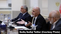 Afghan President Ashraf Ghani (center) and Chief Executive Abdullah Abdullah (left) attend a meeting in Kabul.