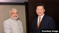 Кытай президенти Си Цзинпин менен Индия премьер-министри Нарендра Моди