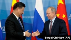 Кытайдын төрагасы Си Цзиньпин менен Орусиянын президенти Владимир Путин. 11-сентябрь, 2018-жыл. 