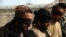 Three of the suspects were presented to reporters in Kandahar late on January 1. Two admitted to taking part in the attack. It was unclear if they were speaking under duress.