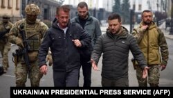 Sean Penn (left) and Volodymyr Zelenskiy walk through Kyiv on November 8, 2022.